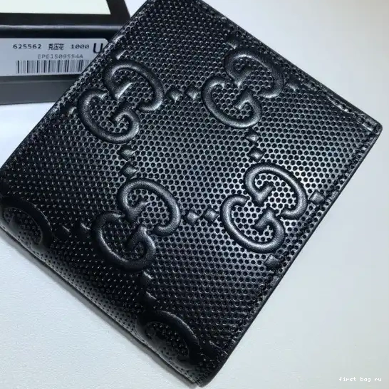 First bag ru GG embossed wallet GUCCI 0217