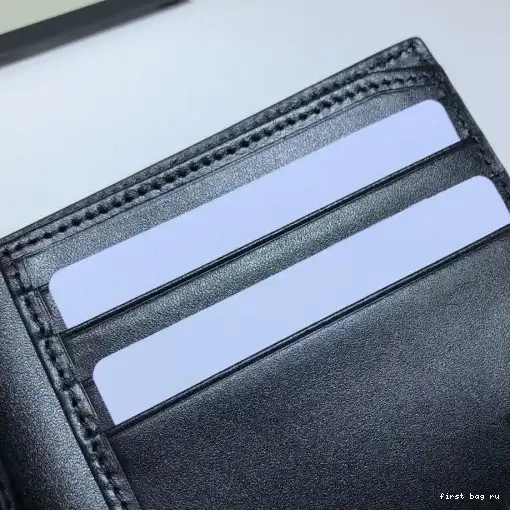 First bag ru GG embossed wallet GUCCI 0217