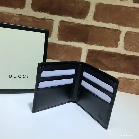 First bag ru GG embossed wallet GUCCI 0217